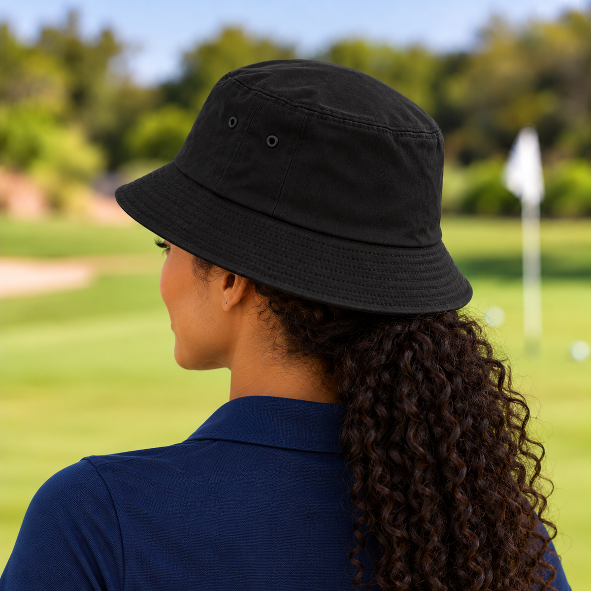 The Fore & After Bucket Hat in black — back golf lifestyle view