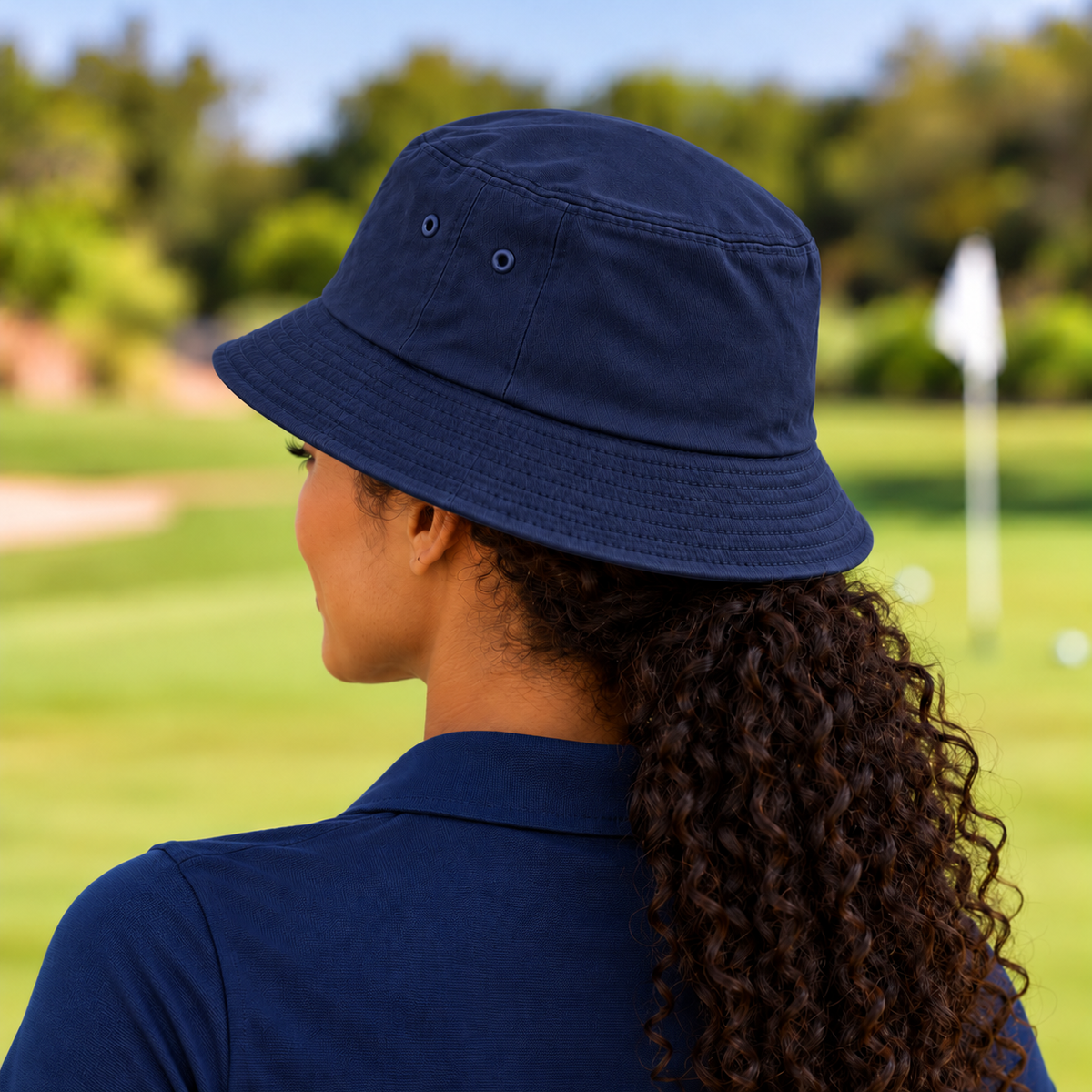 The Fore & After Bucket Hat in navy — back golf lifestyle view