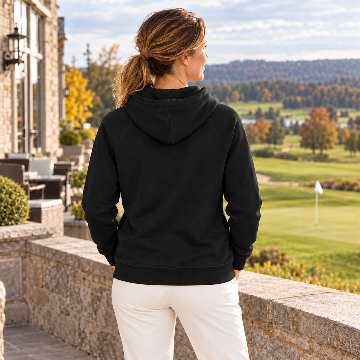 The Fore & After Hoodie in black — back golf lifestyle view