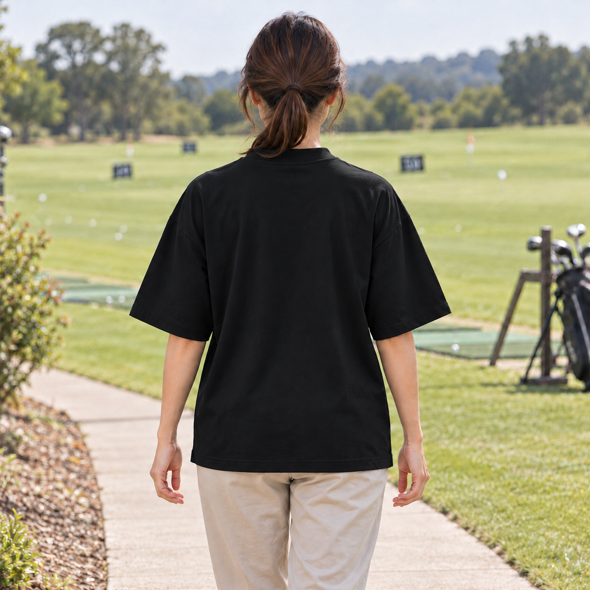 The Fore & After T-Shirt in black — back golf lifestyle view