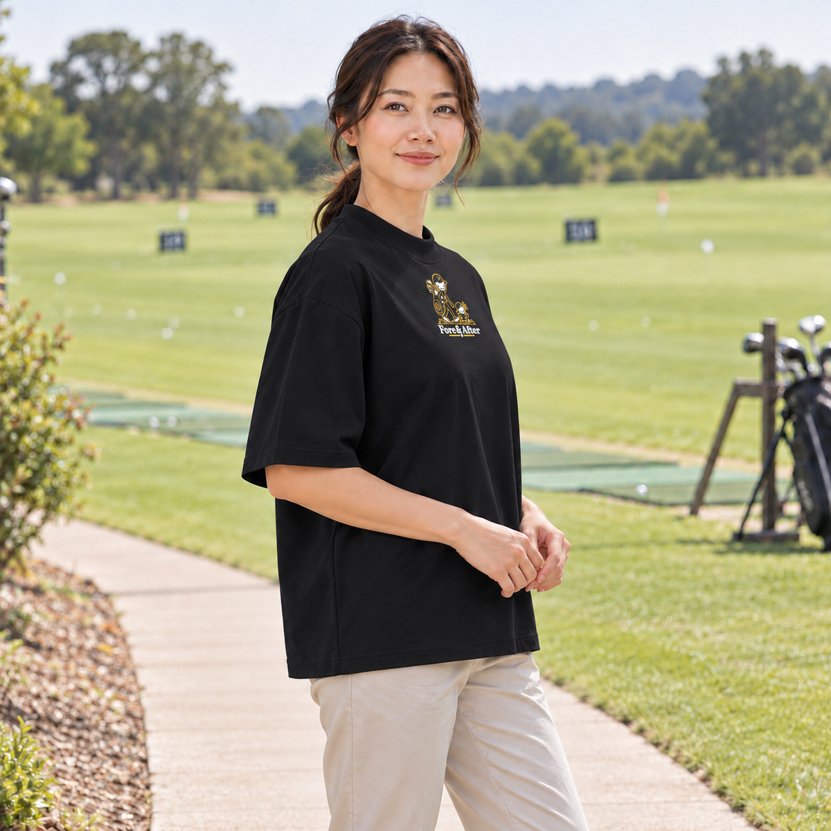 The Fore & After T-Shirt in black — side golf lifestyle view